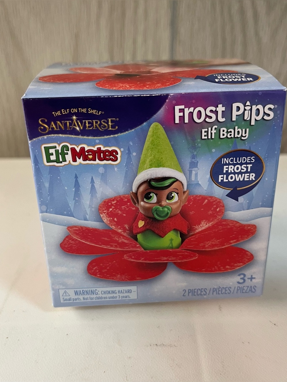 Red Elf Mates Frost Pips Baby Girl with Flower From Elf on the Shelf SantaVerse